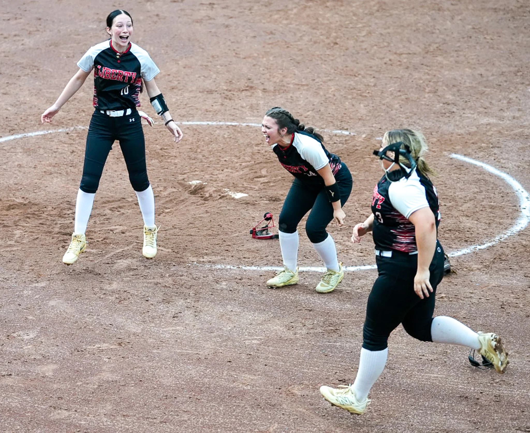 Prep Softball: Liberty finishes sweep of Wyoming East, advances to state tournament matchup with Logan