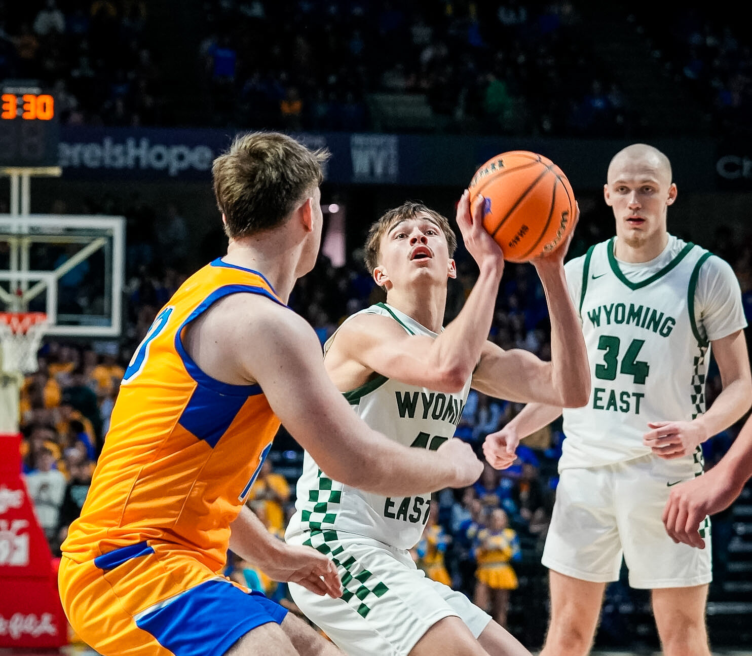 Prep Basketball: Johnson’s performance powers Wyoming East past Logan and into semifinal matchup with Bluefield